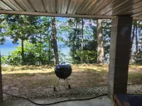 Cozy Cottage with Lake Views and Outdoor Fire Pit - Charming Escape Hotels in Long Lake Township