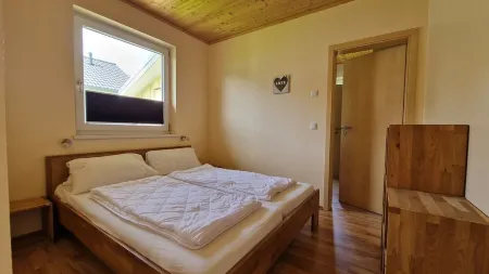 Close to the beach holiday home in a quiet field location with a spacious wooden terrace