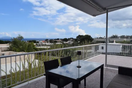 Stunning Seaview Apartment Отели в г. Неа-Макрі