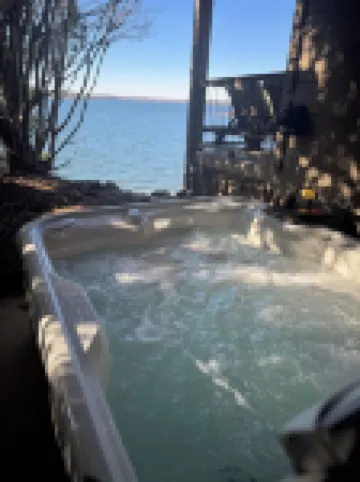 Cozy Lakefront Log cabin with miles of view plus small beach!