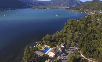 a large body of water , possibly a lake or ocean , with a resort nestled on the shore at Cleopatra Beach