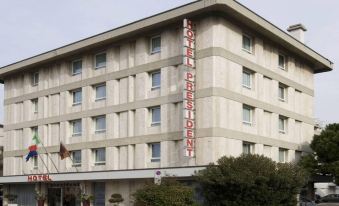 "a modern , white - washed building with the words "" hotel circus "" prominently displayed on its exterior" at Hotel President