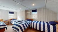 4BR, updated home in Surfside. Sleeps 8 adults, big yard/porch/deck, central air