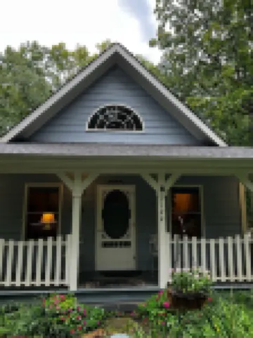 The Blue Cottage located in the woods on Lookout Mountain in Rising Fawn GA