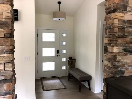 Beautiful new contemporary home, quiet wooded lot minutes from Devils Lake