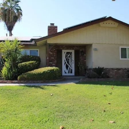 Beautiful Home in quiet neighborhood with a pool and close to stores & highways.