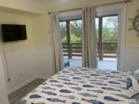 4X4 only! Canal front. Ocean AND sound views! Decks and porches on all levels.