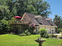 A charming cottage, recently renovated in a serene wooded area of Hanceville, AL