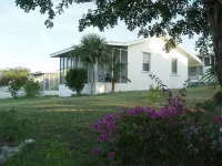On hilltop with pool. Only 400 feet down to waterfront, dock & kayaks. Hotels in 