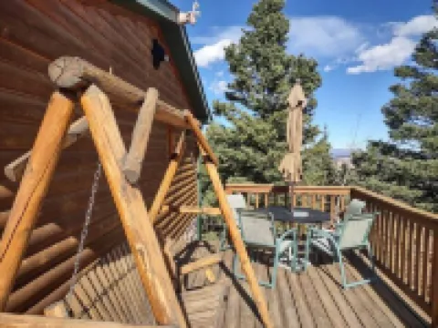 Location!  Nice log home in dark sky community next to several peaks