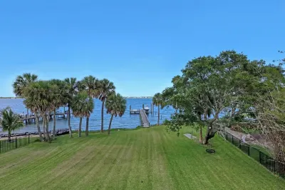 Sweeping Views, Direct Riverfront, Dock, Heated Pool, 8Bed/5.5Bath Sleeps 18 Hotels near Imperial Salon and Spa - Melbourne