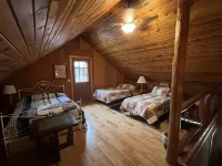 Beautiful log cabin with all the creature comforts of home. Private fishing lake
