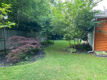 2 Br, 1-1/2 Bath House in Wooded Setting with Private Back Yard, Deck, Hot Tub.