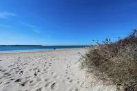 Walk to beach, fenced yard, and toys for the kids!
