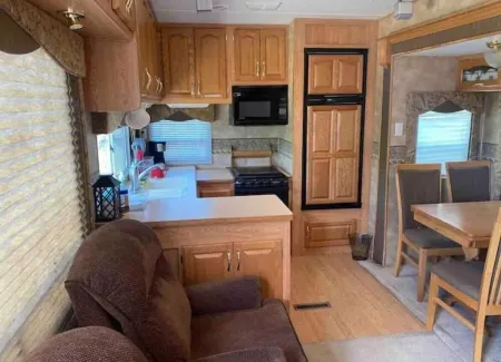 Lake Shore Queen Bed Trailer, Tiki Torches, & Tent Space for Extra Guest