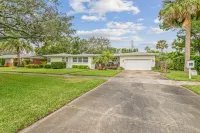 Iconic Front Porch and Timeless Charm - Charming Poolside Oasis