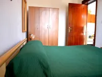 Casa vacanze Tanoshii al piano terra con spazio all'aperto e posto auto
