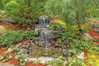 Ideal Lakeshore location in serene wooded landscape with waterfalls.