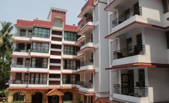 a large apartment building with multiple balconies and a courtyard area in front of it at The Horizon