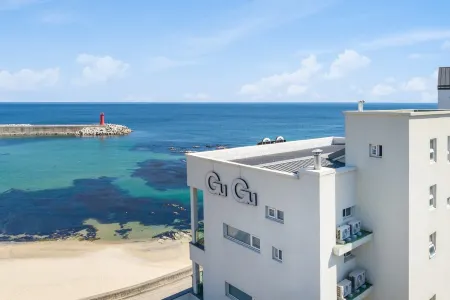 Gangneung Gugu Spa Pension Отели рядом с достопримечательностью «Джумунджин- Бич»