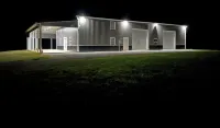 Barndominium in the country. Two acre fishing lake, large porch and Pickleball.
