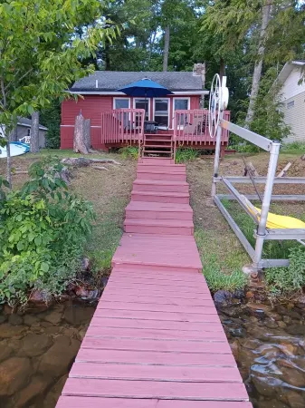 Beautiful full log cabin with  direct private frontage , beautiful sunsets .