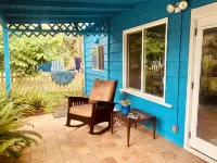 Charming beach cottage in a beautiful garden setting.