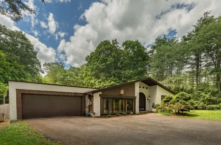 Heated pool, outdoor deck, fire pit, basketball court, fireplaces, central air.