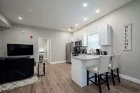 Exposed Brick and Modern Kitchen Amenities - Charming Historic Retreat