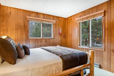 Lakefront Home with a Private Dock, Deck, Fireplace, Spacious Yard, & Playset