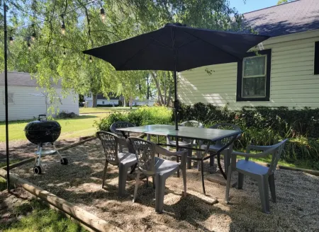 Charming Lakeview Cottage with Fire Pit and Outdoor Seating - Cozy Retreat