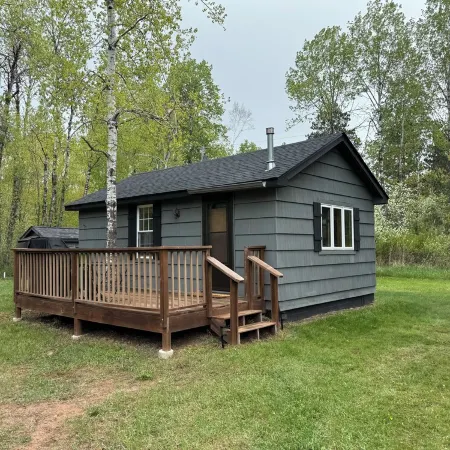 Charming cabin in delightful Duquette with AC near miles of ATV trails.