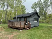 Charming cabin in delightful Duquette with AC near miles of ATV trails.