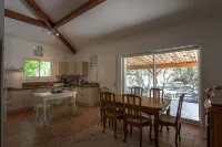 house located in a haven of greenery 15 minutes walk from the beach of Maora