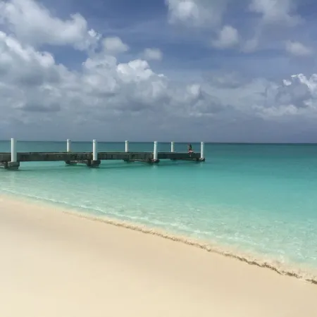 A few steps from the door and you're on Grace Bay Beach!