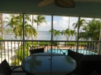 Stunning beachfront condo next to restaurant & a short drive to famous RumPoint