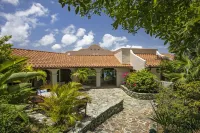 Amazing sunset, ocean front, open air villa w/path to sea and dock