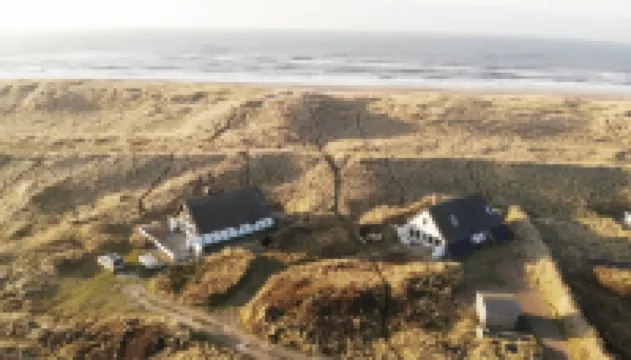 House with a luxurious location in the dunes only 75 meters from North Sea waves