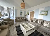 Pendragon House Overlooks Crooklets Beach in Bude with parking for 5 cars.