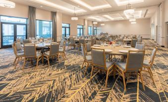 a large dining room with multiple tables and chairs arranged for a group of people to enjoy a meal together at Courtyard Thousand Oaks Agoura Hills