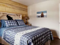 Beautiful hand-crafted log cabin on Horse Creek one block off Main Street.