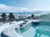 Cozy modern cabin with amazing views, hot tub, firepit, and more!  5 min to town