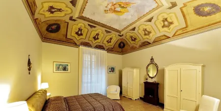 Historic house with garden in front of the Grotta Giusti Thermal pool near Lucca