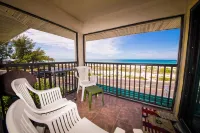 Family beach condo. Steps to sand and restaurants + bars!