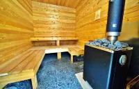 Central yet quiet Log Cabin on 4 acres with laundry, kitchen, bathroom and sauna