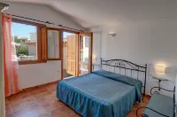 Residence Bouganvillage Hotels near Spiaggia di Porto Ainu