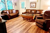 Spacious suite surrounded by nature with living room, fireplace, porch, fire pit