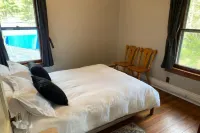 Spacious river front get-away with pool next door!