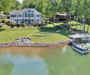 Go Jump In the Lake! Just Listed Custom Lakefront Home with Dock & Amenities!