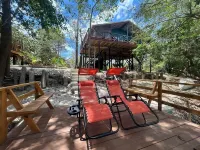 Amazing Jungle Tree House right over the river with bikes and canoe